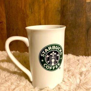 Tall Starbucks mug.